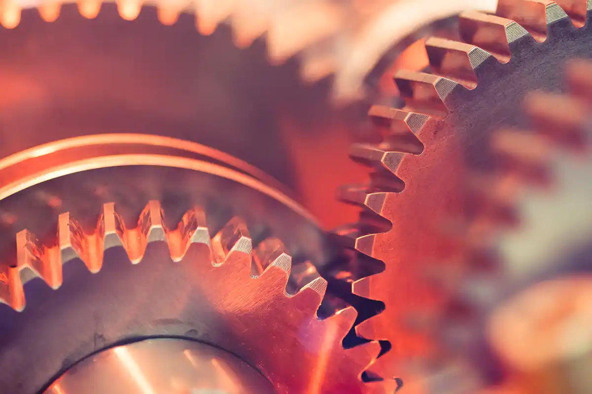 A red lite series of metal gears/cogs.