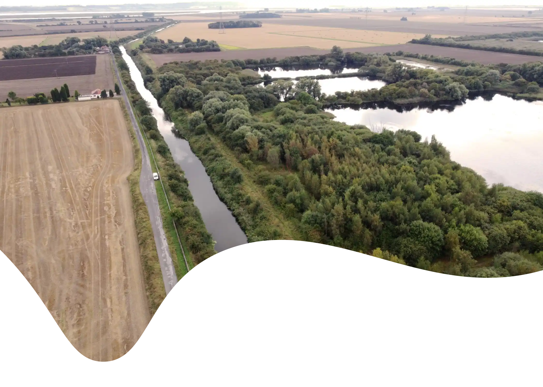 Aerial view of the Market Weighton Canal Trail masked in a fluid shape.
