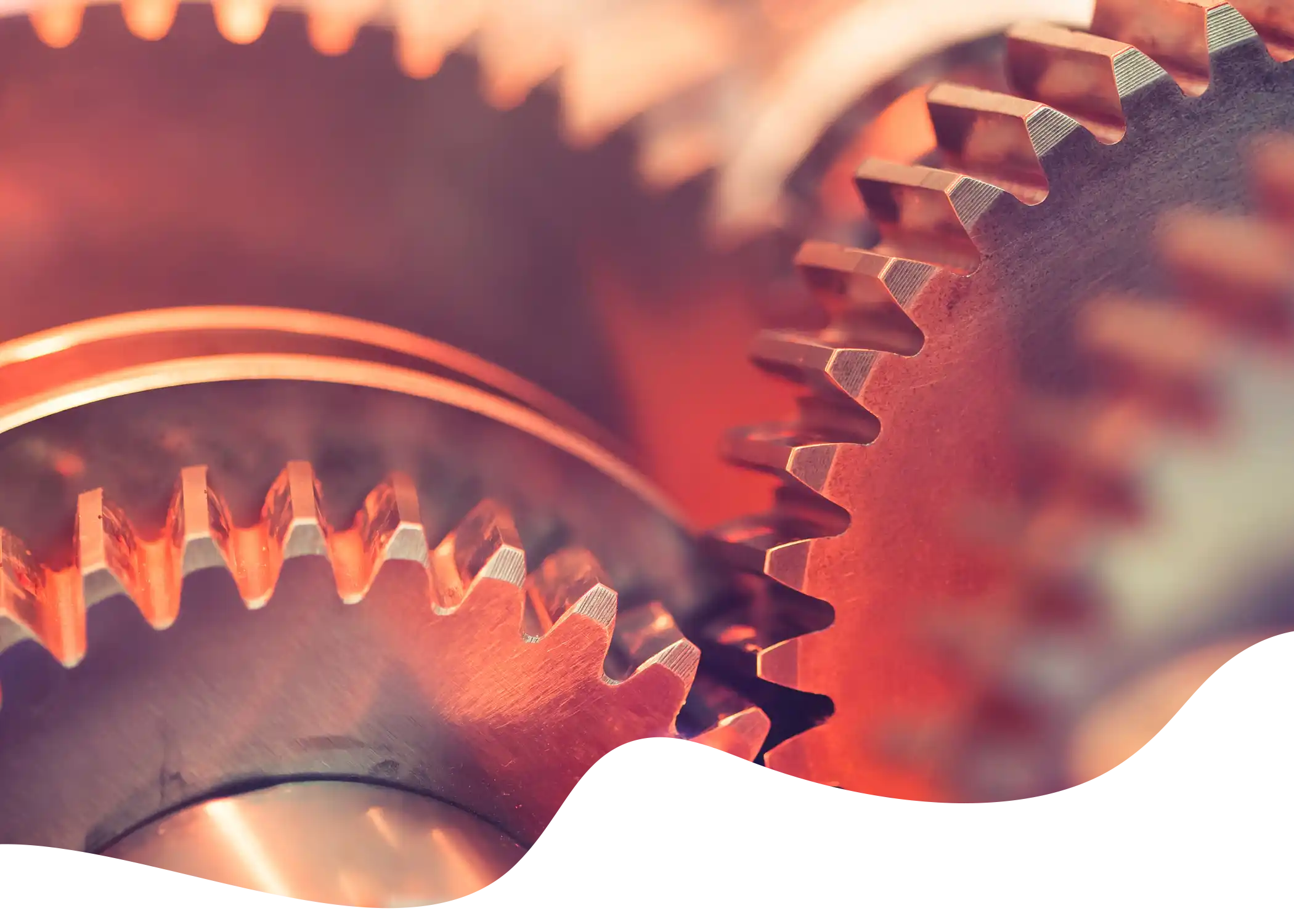 A red lite series of gears/cogs masked into a fluid shape.