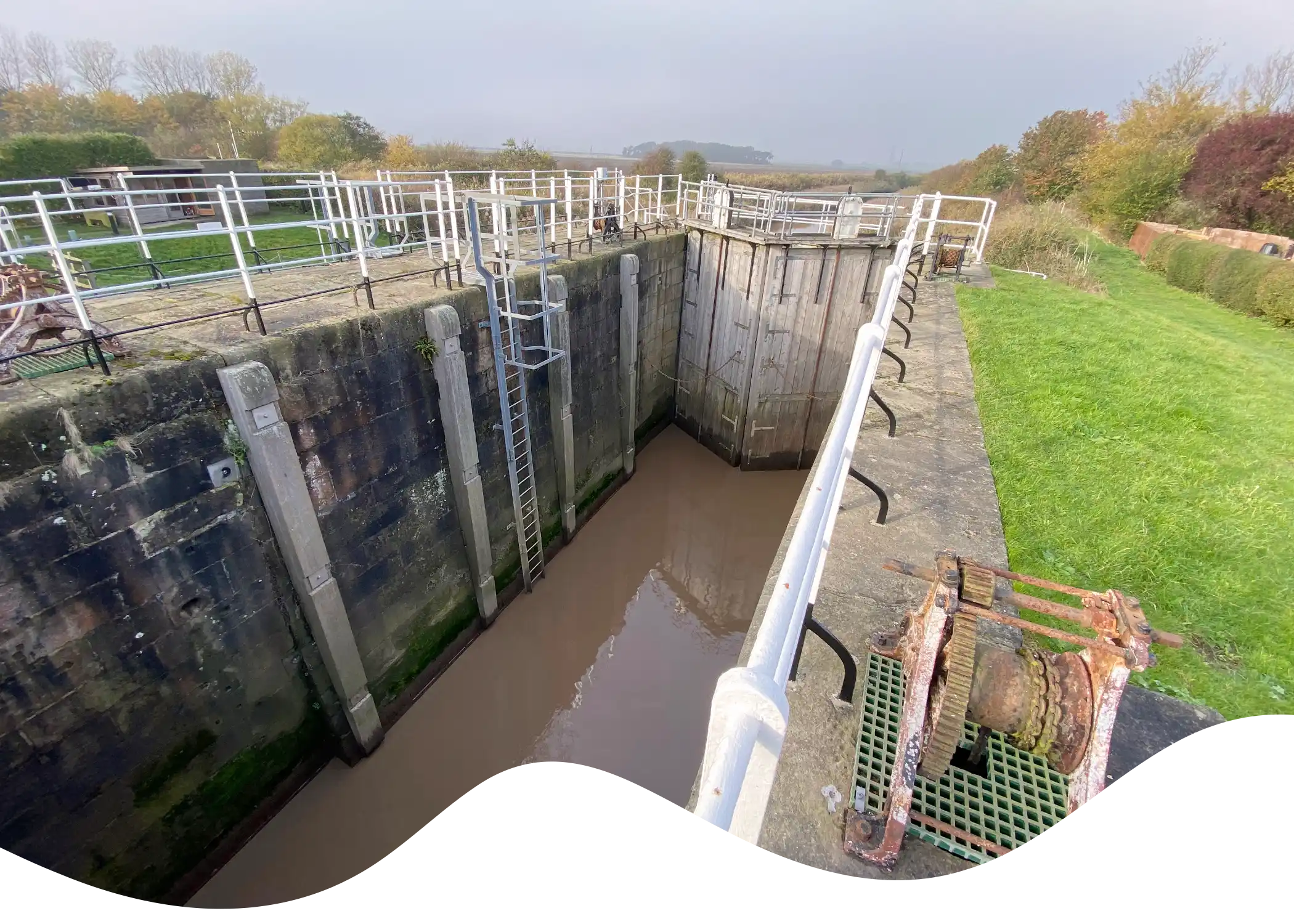 View inside and along the Weighton/Humber Lock looking north to the Southern start of the Canal Trail masked into a fluid shape.