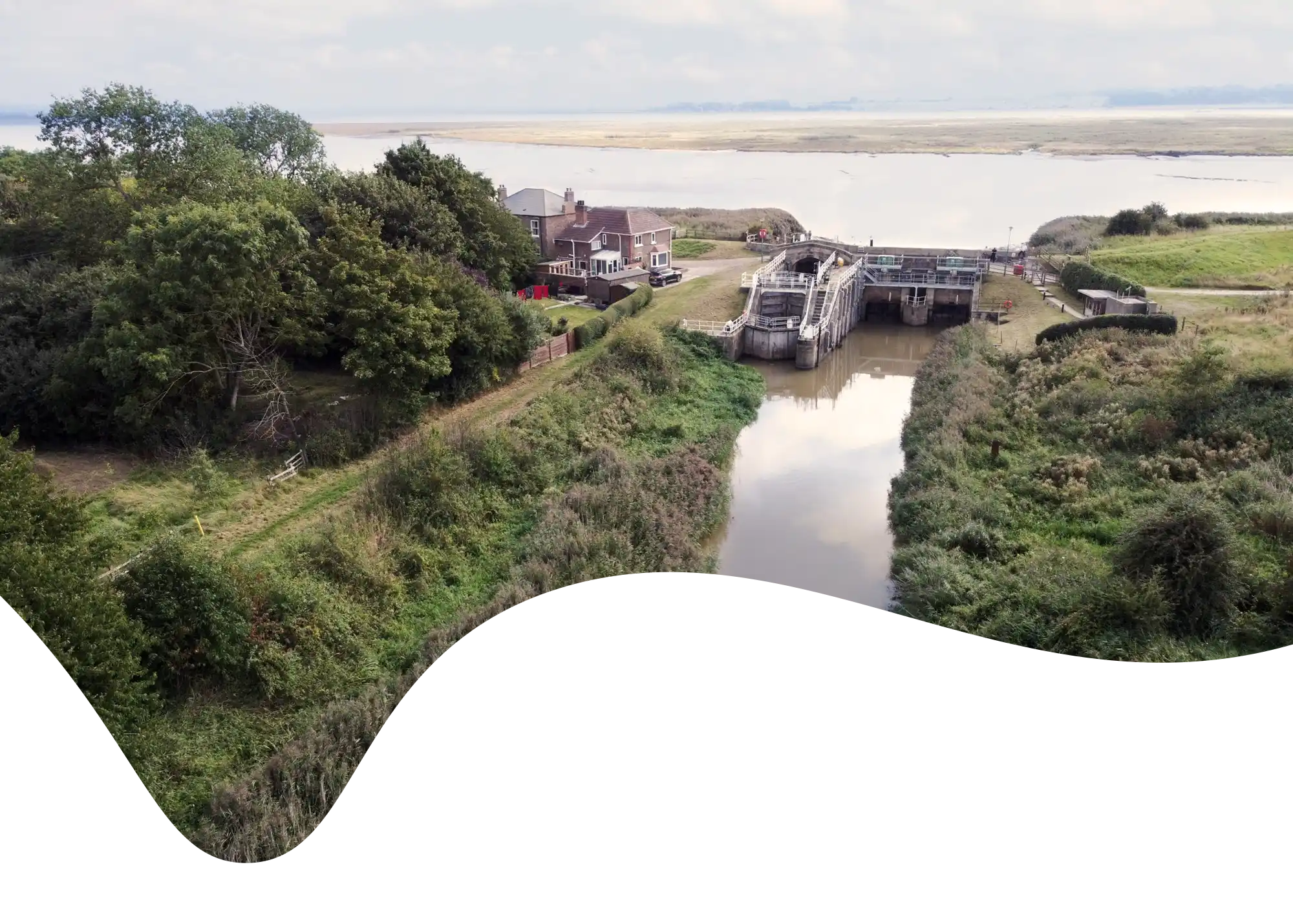 An aerial of Weighton/Humber Lock looking south toward Whitton Island masked in a shape taken in 2022.